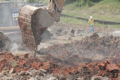 The work plan for today is to continue soil stabilization efforts, installing berms and protective covering to minimize further slide movement.